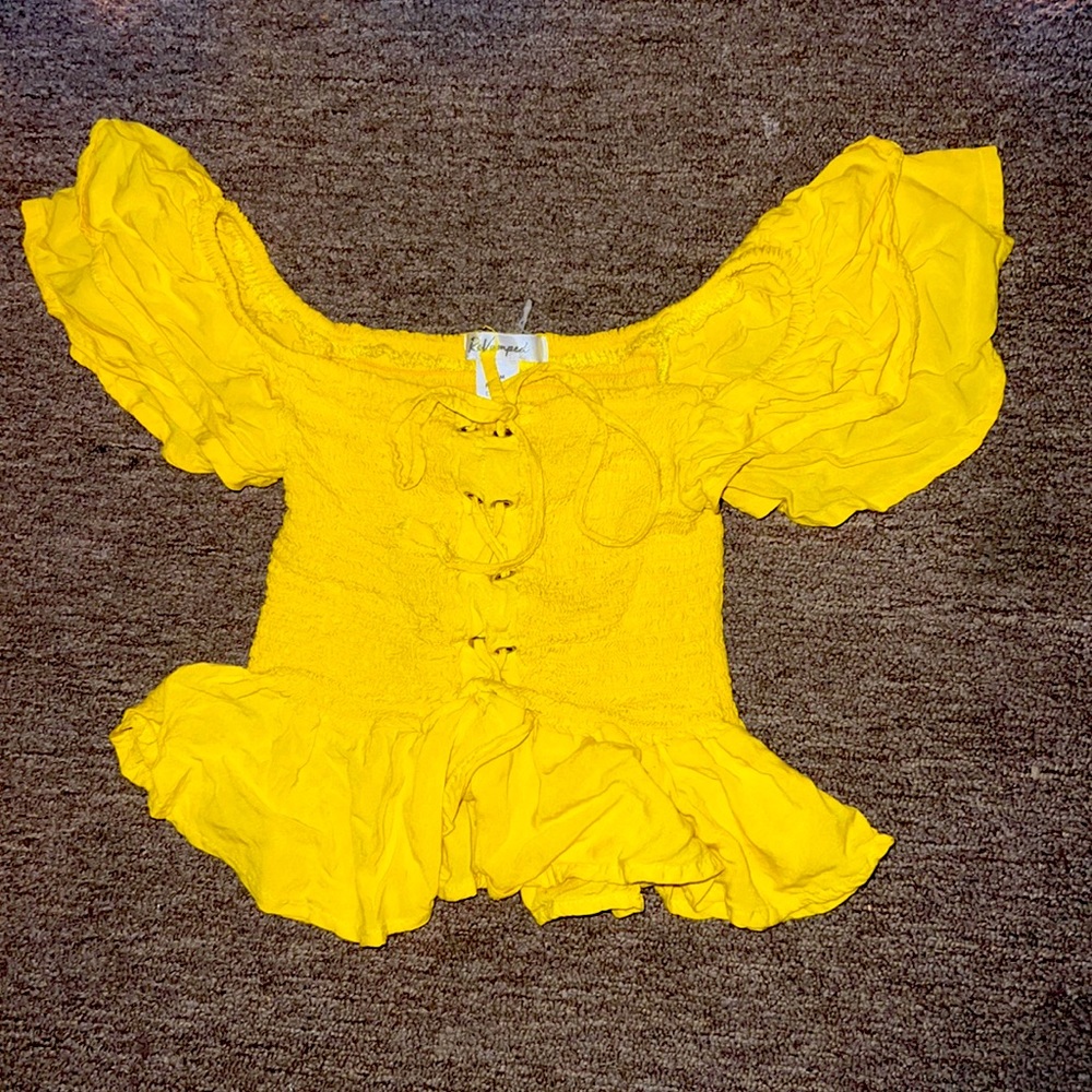 This a cottage core yellow top. We have size small, medium and large.
